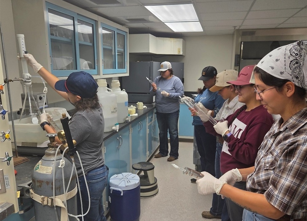 Interns learn a new technique (Gas Production from forage and supplements that utilize rumen fluid collected from cows fitted with a rumen fistula).