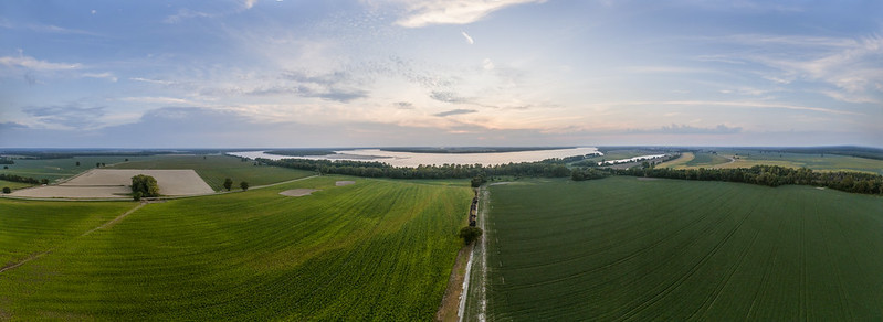 landscape photo of fields and a river