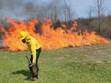 Instructor Dan Zay starts a controlled burn  during a training event at the Rose Lake Plant Materials Center.