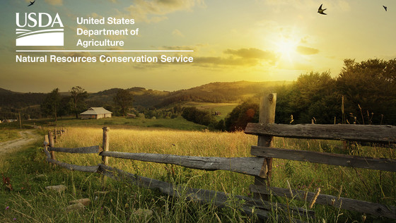 NRCS ranch with fence at sunset - Image used to promote CSP has USDA logo with NRCS name