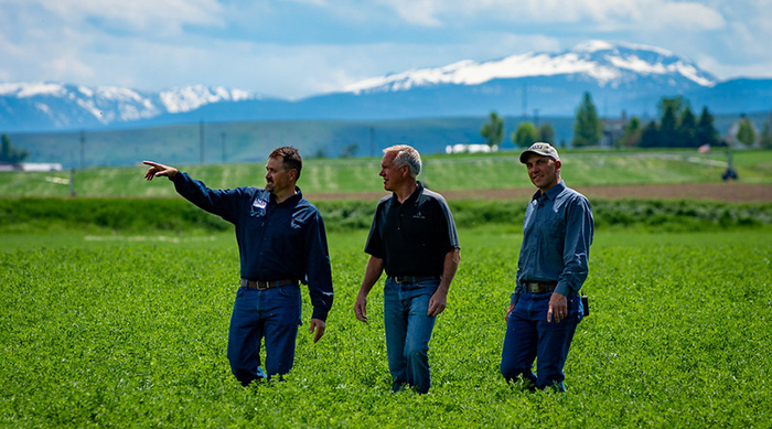 Landowner, NRCS conservationist, and land trust representative tour a recently conserved property.