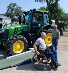 Farmer Doug Ver Hoeven demonstrates adaptive equipment for farmers with disabilities.