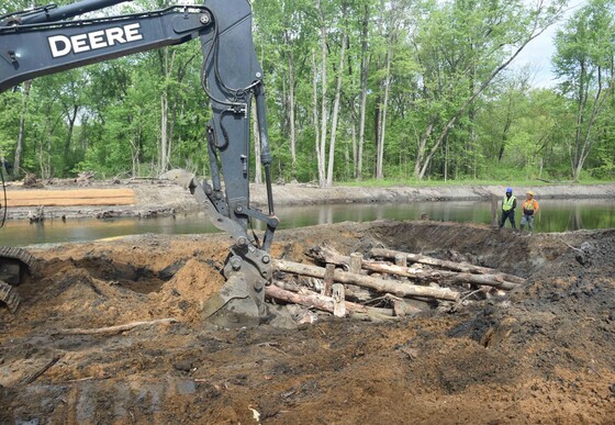 Interlocking timbers are installed along the Dowagiac River to provide stability when meanders are restored to the river.