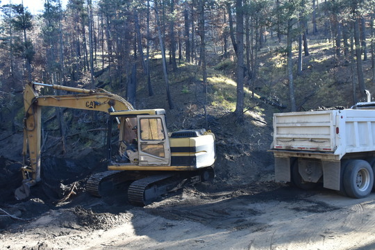 Tractor removing Debris