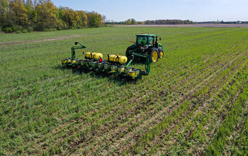 Tractor in a farm field. Image used to promote Public Comment period for NRCS 8 new  conservation practices.