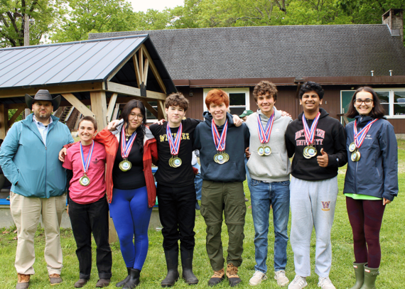NRCS State Resources Conservationist, Cassius Spears, Jr. (left), awards 2025 RI Envirothon Champs, Wheeler School, Team 1.