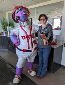 Eaton CD Executive Director Rachel Cuschieri-Murray with Lugnuts mascot Big Lug at the June 1 Conservation Carnival held at Jackson Field in Lansing.