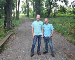 Ryan and Christopher Thatcher stand on a stream crossing on their farm in Mecosta County. The USDA EQIP program provided assistance for the practice.