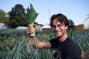man holding leek