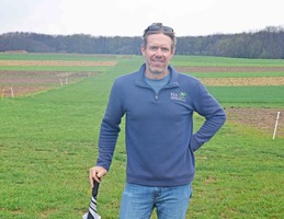 Brook Wilke, at MSU's W.K. Kellogg Biological Station, with test plots for five rotational crops in an ongoing field trial.