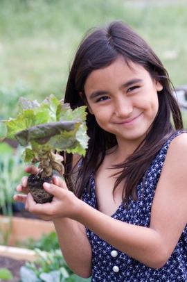 Young Girl holding plant