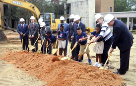 SC State University officials and Smart Academy youth break ground for a new community center. By Christopher Huff 