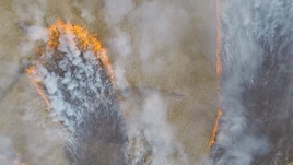 Camera view of a wildfire taken from a drone specially fitted to analyze fire and wind data. Photo courtesy of Xiaolin Hu.