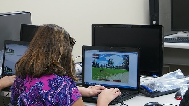 A student plays one of the 7 Generation Games. Photo by Maria Burns Ortiz
