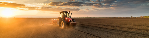 Funding Opportunity- FY 2021 AFRI Sustainable Agriculture Initiative. Image of tractor in field, courtesy of Getty Images.