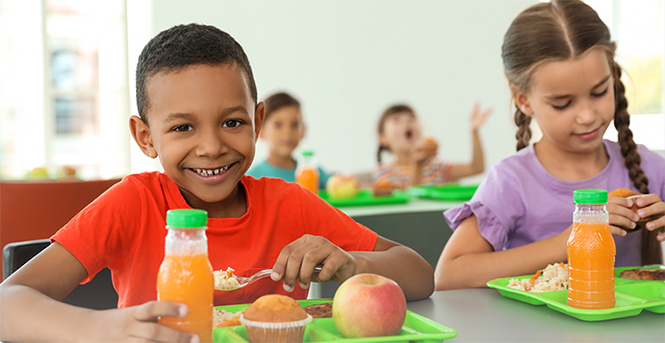 Food and Agriculture Service Learning Program. Image of school children in lunchroom  courtesy of Adobe Stock.