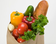 Grocery bag full of vegetables image courtesy of Getty Images.