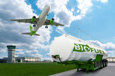 Biofuel tank with airplane flying overhead; image courtesy of Getty Images.