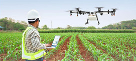 Image of farmer with drone in field courtesy of Adobe Stock.
