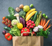 Shopping bag full of fresh vegetables and fruits, courtesy of Adobe Stock.