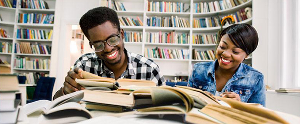 Funding Opportunity: Centers of Excellence at 1890 Institutions. Image of two college students, courtesy of Adobe Stock.