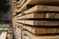 Pile of wooden boards in the sawmill, courtesy of Adobe Stock.
