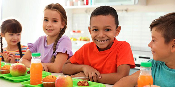 Funding Opportunity - Food and Agriculture Service Learning Program. Image of children in school cafeteria courtesy of Adobe Stock. 