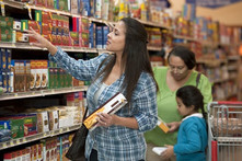 A family shops for pasta, courtesy of USDA’s Food and Nutrition Service. 