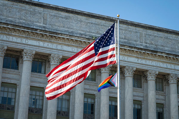 The Pride flag is raised at USDA Headquarters at the Whitten Building in Washington, D.C.