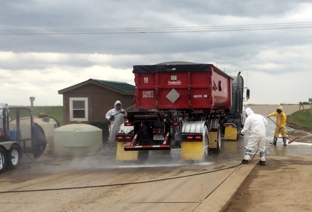 USDA and contract workers conduct cleaning and disinfection as loads leave a premises. USDA photo by Mike Milleson.