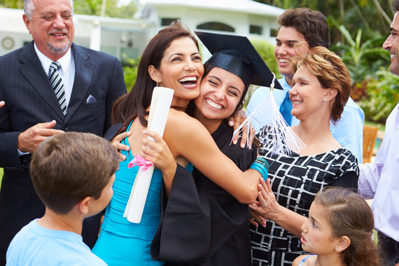 Hispanic family celebrating graduation