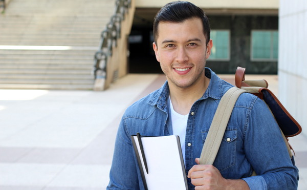 College student on campus, courtesy of Adobe Stock.