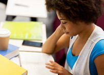 Female student studying, courtesy of Adobe Stock.
