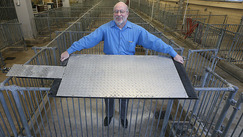 Robert M. Stwalley, Purdue University, shows a cooling pad. Image courtesy of Purdue Agricultural Communication