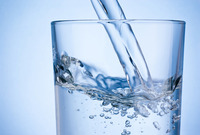 Water pouring into a glass. Image courtesy of Adobe Stock.
