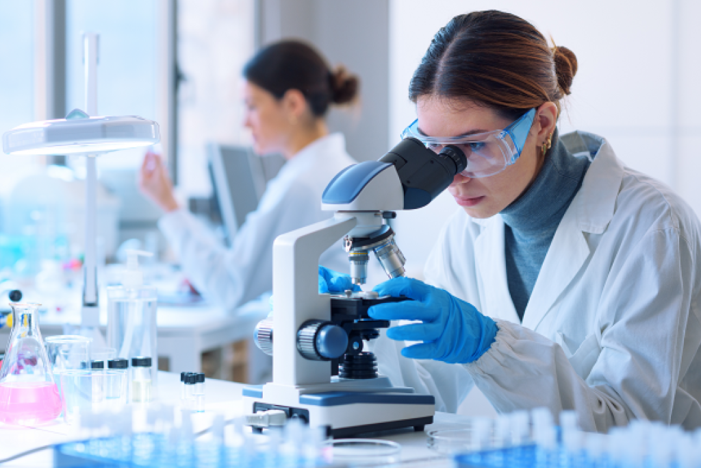 Scientists at work in lab. Image courtesy of Adobe Stock.