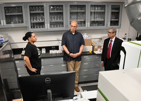 WVSU student Ameris Chadband and Dr. Amir Hass share their NIFA-funded research projects with Dr. Misra. Photo courtesy of WVSU.