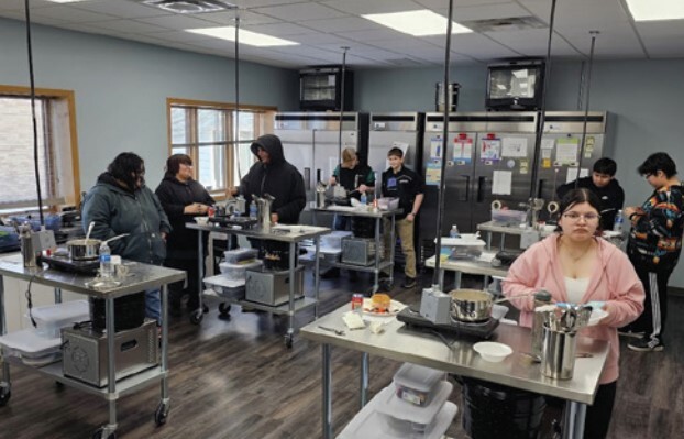 Students training in the Cankdeska Cikana Community College commercial teaching space. 