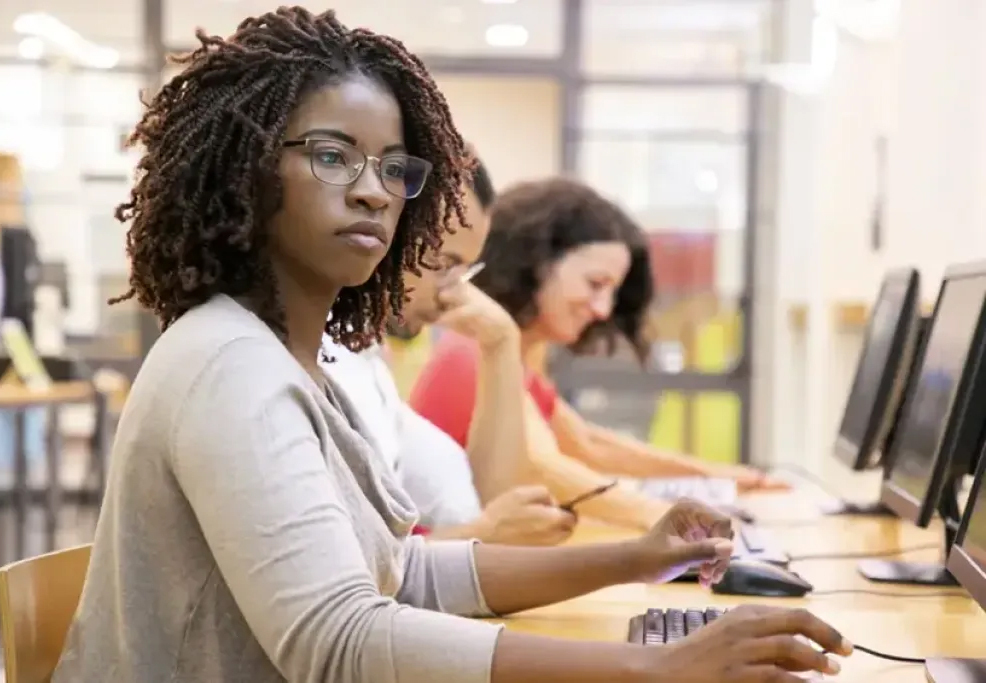 College student working at computer, courtesy of Adobe Stock. 1890 CBG RFA image
