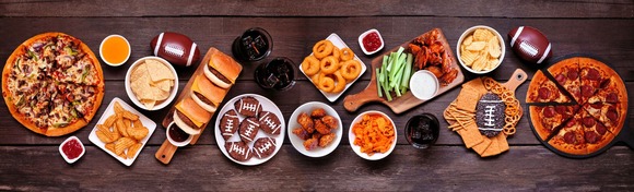 Super Bowl party food spead.  Image courtesy of Adobe Stock.