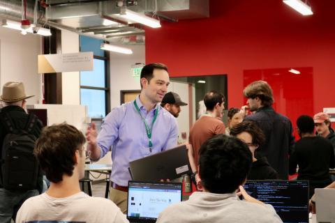 Students ask USDA AI Fellow Kyle Psilopoulos for technical advice and guidance on their approach. USDA image.