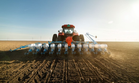 Tractor planting soybeans. Image courtesy of Adobe Stock.