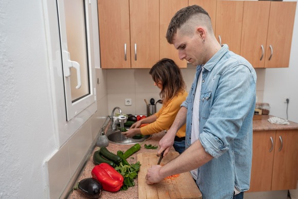 Couple preparing a meal. Image courtesy of Adobe Stock. 