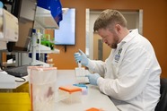 SDSU microbiologist prepares a meat sample for testing. Image courtesy of South Dakota State University.