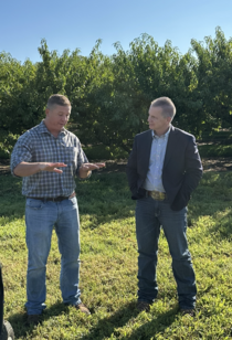 NIFA Director Dr. Jaye Hamby talking with Clemson University researcher.