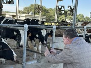 NIFA Legislative Affairs Officer Gary Mayo taking photos at Clemson University dairy.