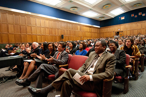 Agriculture Assistant Secretary for Civil Rights Dr. Joe Leonard (right) and an auditorium full of USDA employees