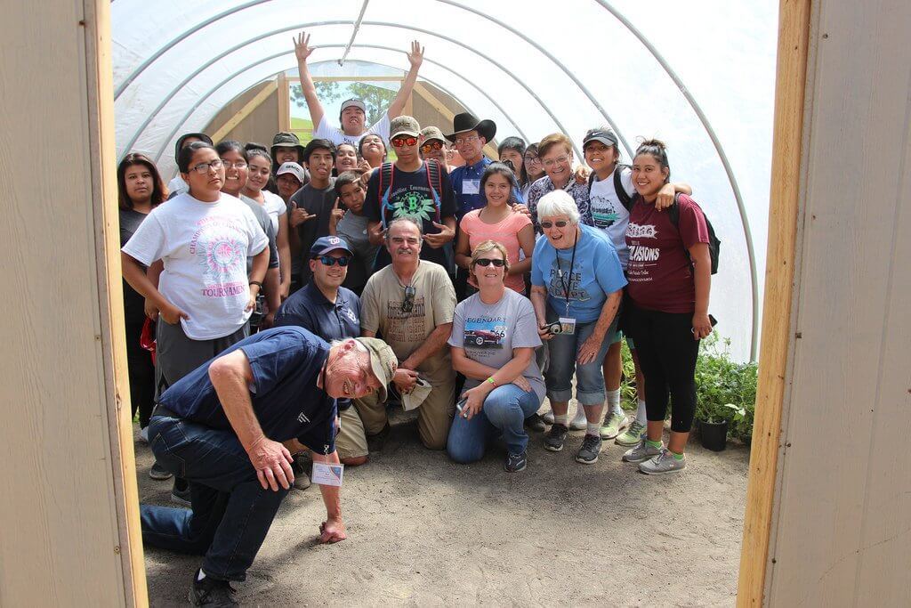Reno-Sparks Indian Colony teens pose to celebrate a finished hoop house they built.