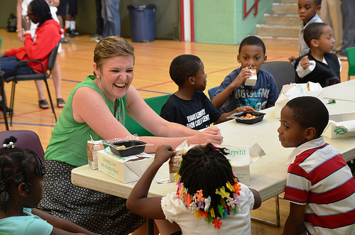 USDA Center for Faith-Based and Neighborhood Partnerships Director Norah Deluhery eats lunch with kids