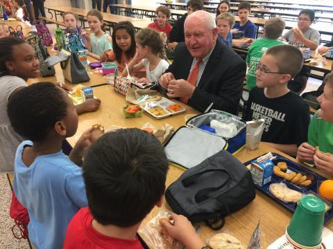 Secretary of Agriculture Sonny Perdue eats lunch with students at Catoctin Elementary School.